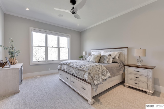 bedroom featuring ceiling fan, crown molding, and light carpet