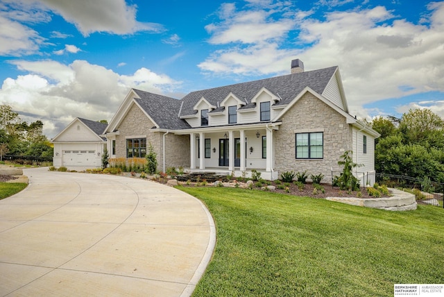 view of front facade featuring a garage, a porch, and a front yard