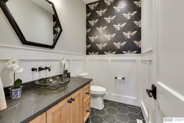 bathroom with tile patterned floors, vanity, and toilet