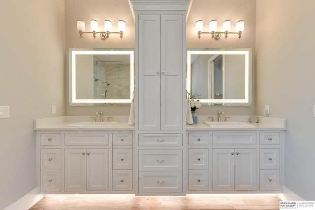 bathroom featuring vanity and walk in shower