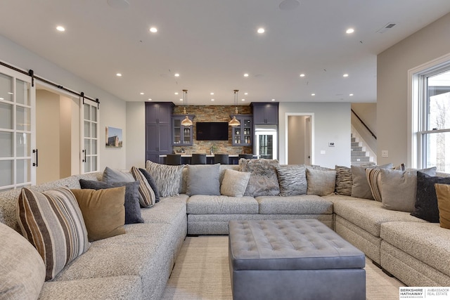 living room featuring a barn door