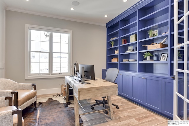 home office with ornamental molding and light wood-type flooring