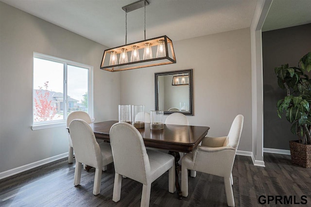 dining space with dark wood-type flooring