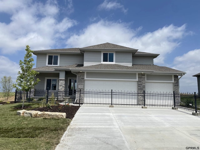 prairie-style house featuring a garage