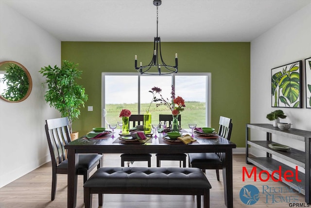 dining room with a chandelier and wood-type flooring