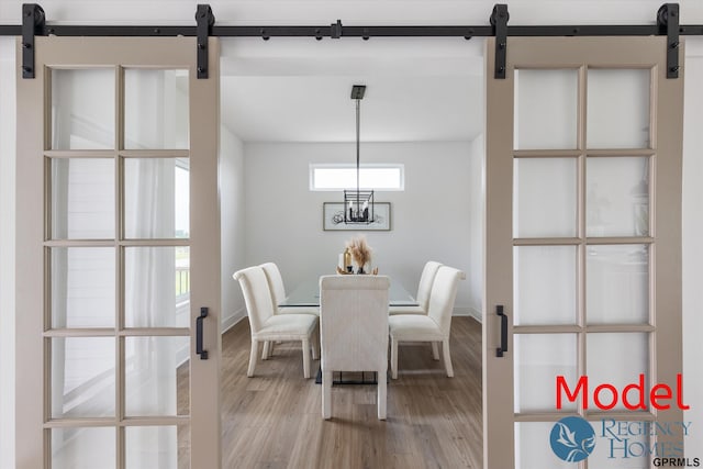 dining space featuring wood-type flooring