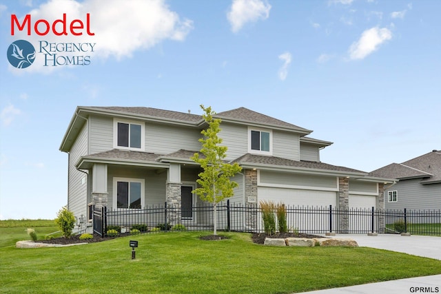 prairie-style home featuring a front yard and a garage