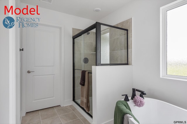 bathroom with plus walk in shower and tile patterned floors