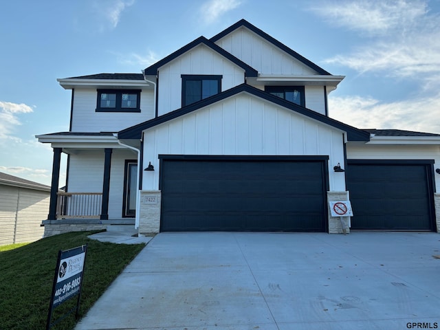 view of front of home featuring a porch and a garage