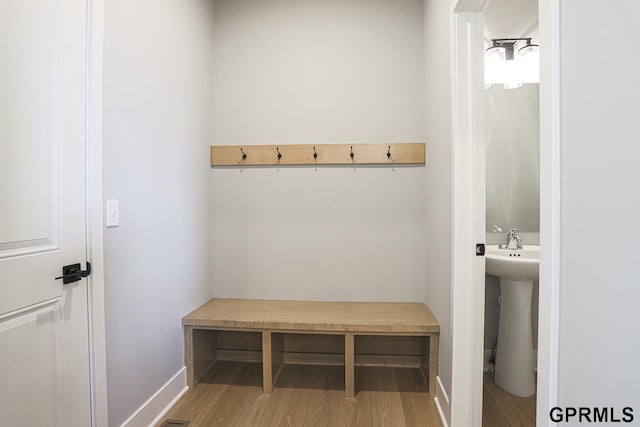 mudroom featuring sink and hardwood / wood-style flooring