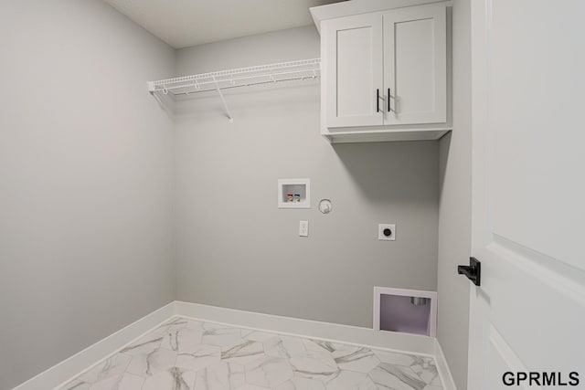 laundry area featuring cabinets, washer hookup, gas dryer hookup, and electric dryer hookup