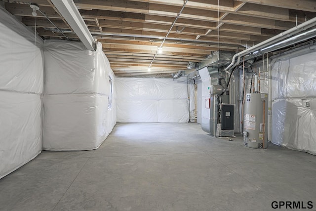 basement featuring heating unit and gas water heater