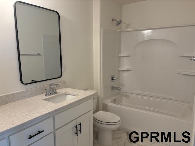 full bathroom featuring washtub / shower combination, vanity, and toilet