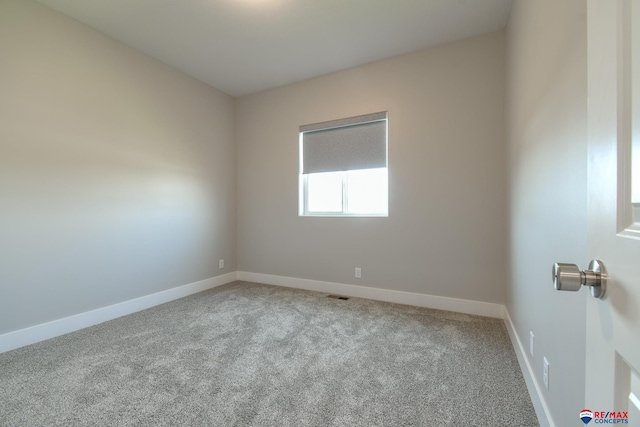 empty room with light colored carpet