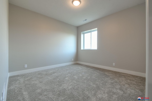 spare room featuring carpet flooring