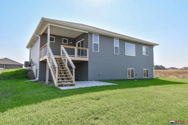 back of house with a patio area, a yard, and a deck