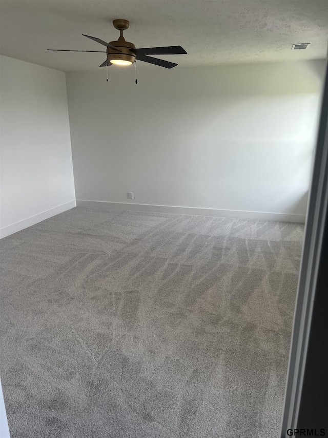 unfurnished room featuring carpet flooring and ceiling fan