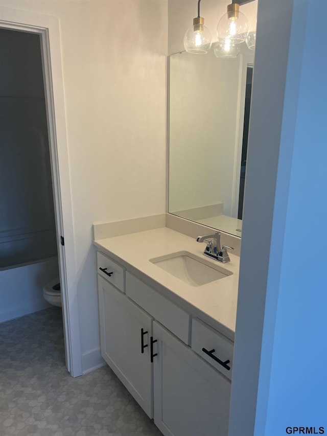 bathroom with vanity and toilet