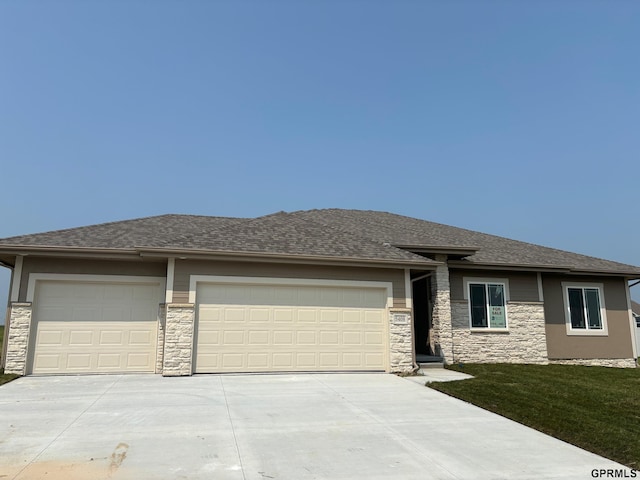 prairie-style house featuring a garage