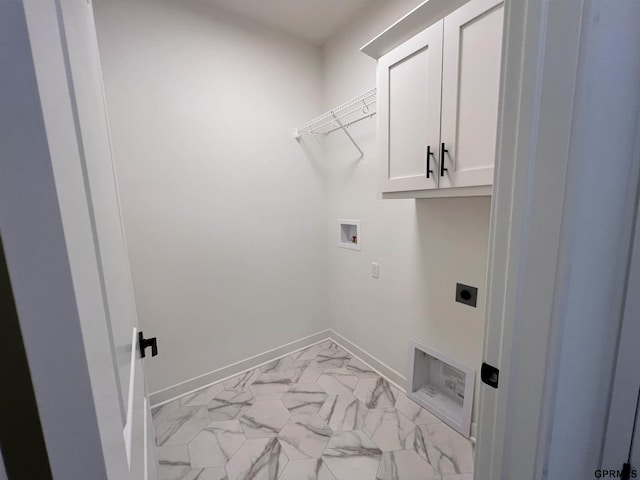 laundry area with cabinets, hookup for a washing machine, and hookup for an electric dryer