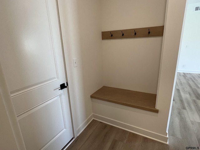 mudroom with light hardwood / wood-style floors