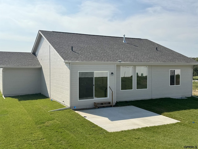 back of house with a patio area and a lawn