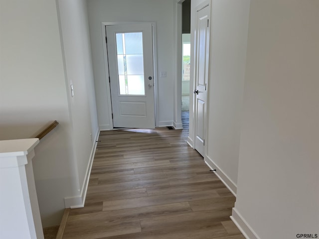 doorway with light hardwood / wood-style floors