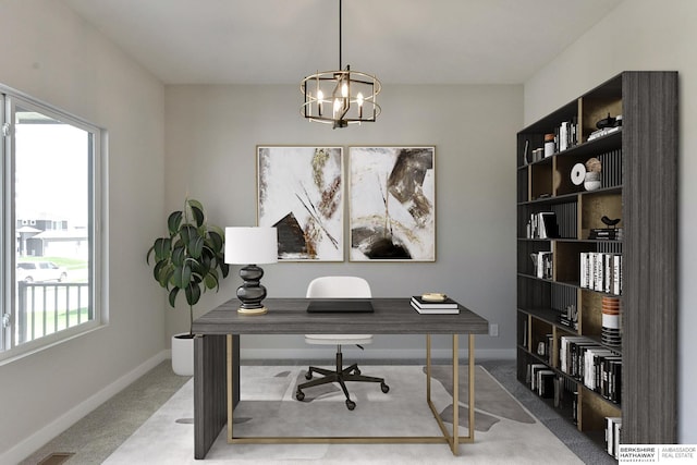 home office with a chandelier and carpet