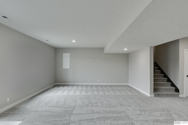 basement with light colored carpet