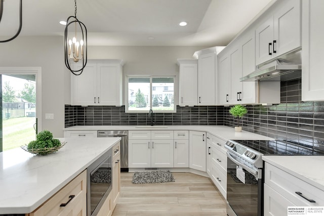 kitchen featuring white cabinetry, appliances with stainless steel finishes, sink, and decorative backsplash