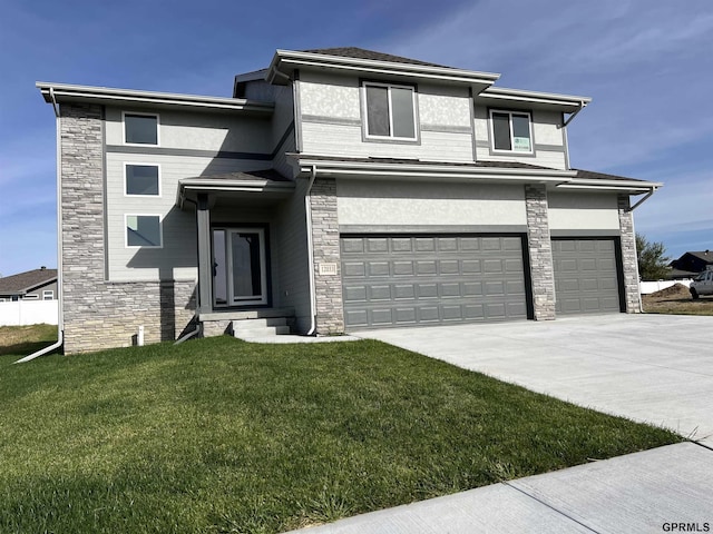 prairie-style house with a garage and a front yard