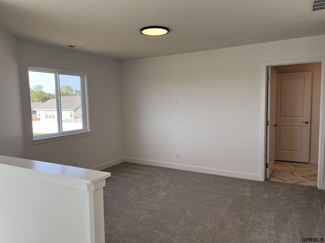 spare room featuring carpet flooring