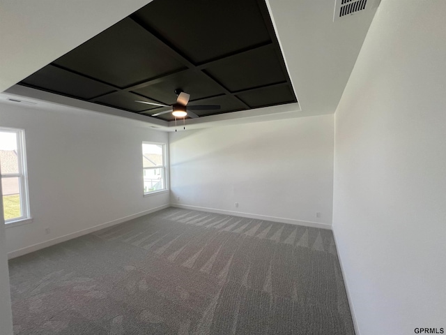 spare room featuring carpet and ceiling fan