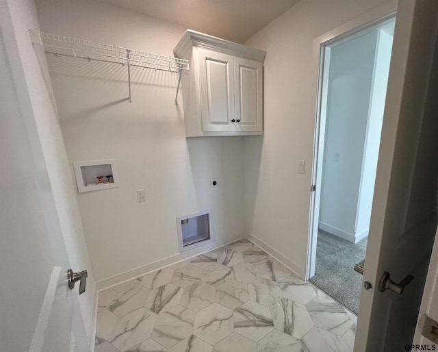 laundry area with electric dryer hookup, hookup for a washing machine, and cabinets