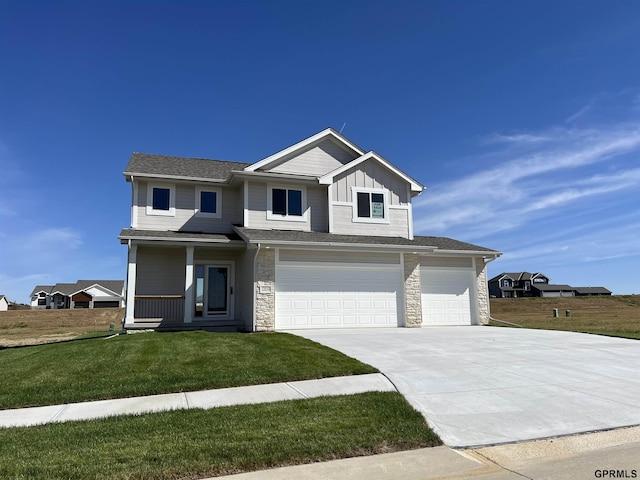 view of front facade with a garage and a front lawn