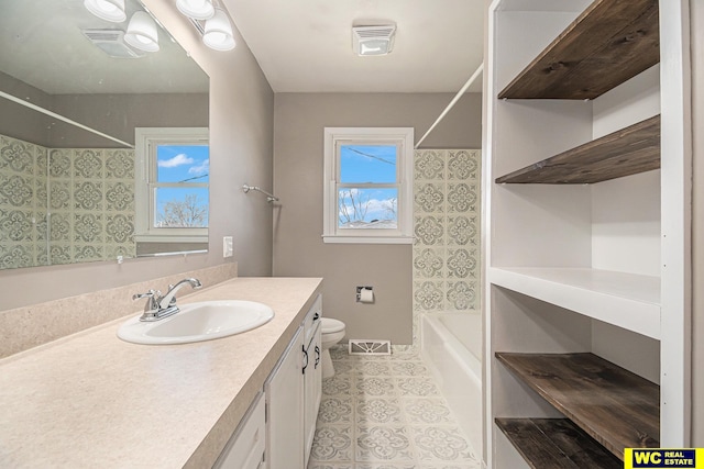 full bathroom with tile patterned flooring, vanity, toilet, and shower / tub combination