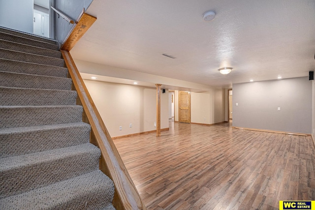 basement featuring hardwood / wood-style floors