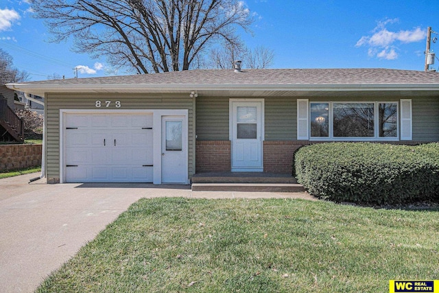 ranch-style home with a front yard and a garage