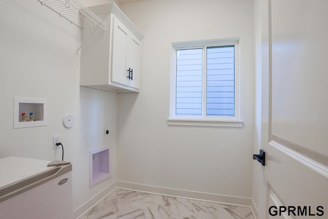 laundry room with washer hookup, gas dryer hookup, cabinets, and hookup for an electric dryer