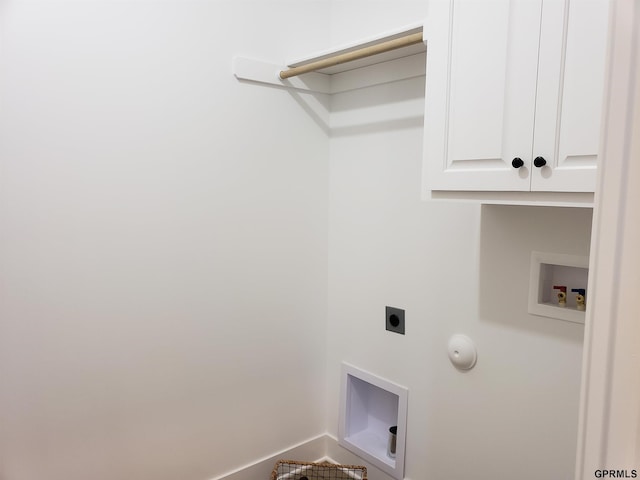 laundry area with electric dryer hookup, cabinets, hookup for a washing machine, and hookup for a gas dryer