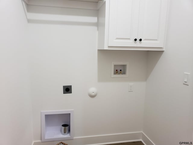 washroom with hookup for an electric dryer, hookup for a gas dryer, cabinets, and hookup for a washing machine