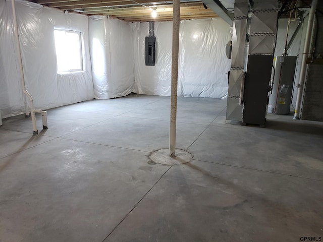 basement with electric panel and heating unit