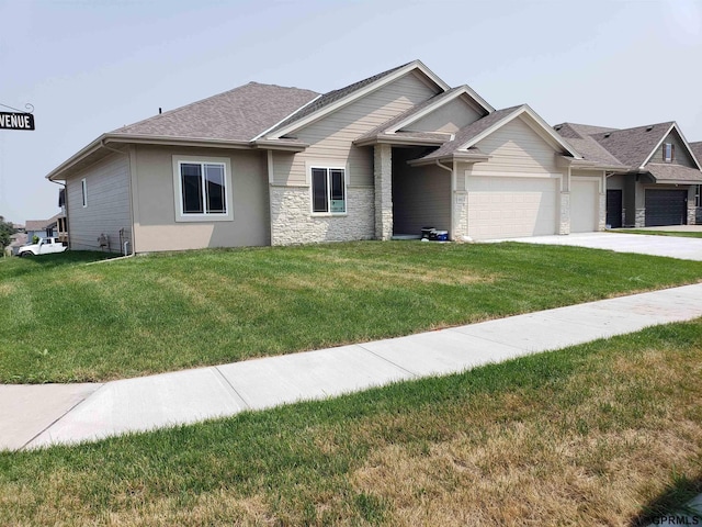 view of front of house featuring a garage and a front lawn