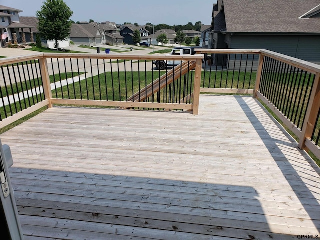 wooden terrace with a yard