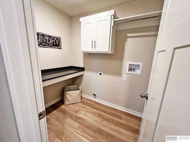 washroom with cabinets, light wood-type flooring, washer hookup, and hookup for an electric dryer