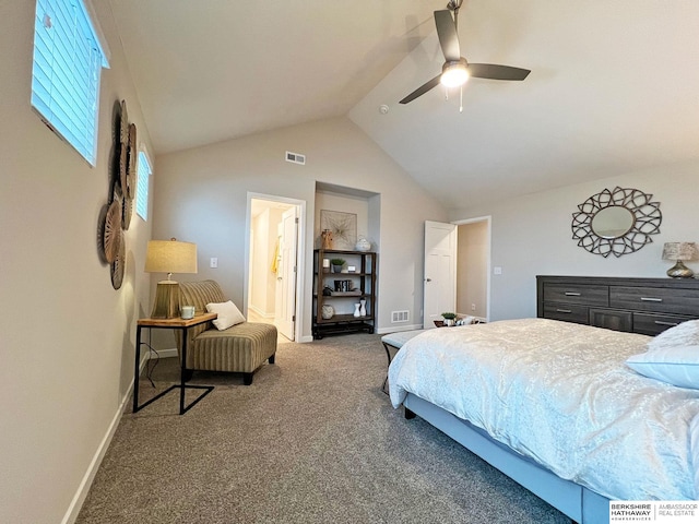 bedroom with carpet floors, ceiling fan, lofted ceiling, and connected bathroom