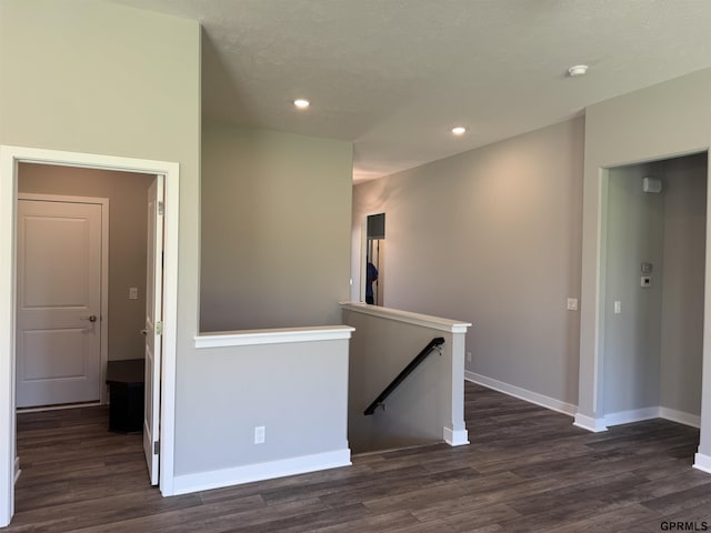 hallway featuring dark hardwood / wood-style floors