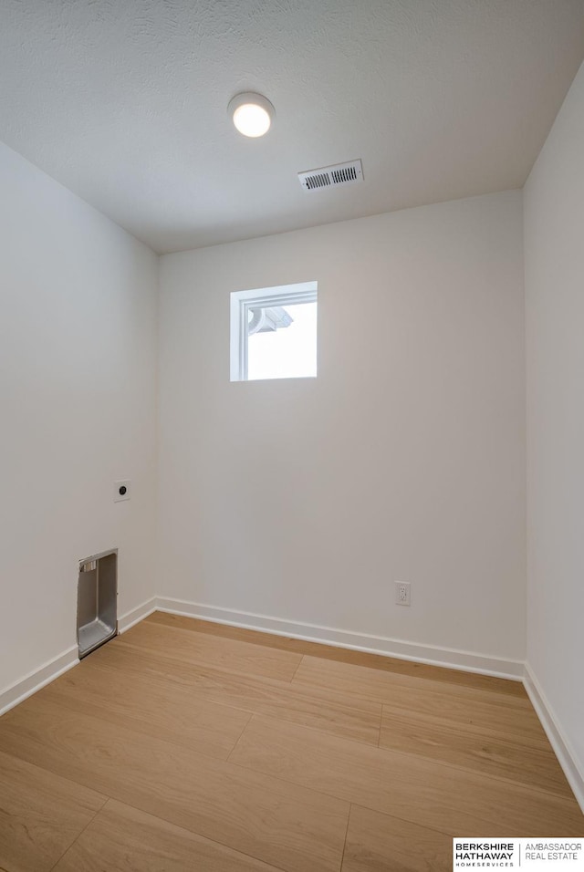 unfurnished room featuring wood-type flooring