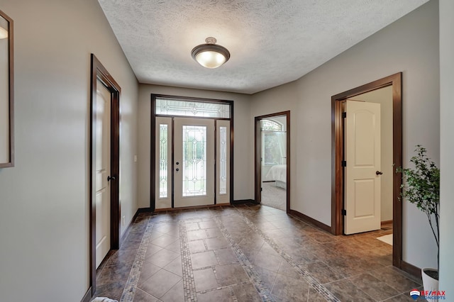 entrance foyer with a textured ceiling