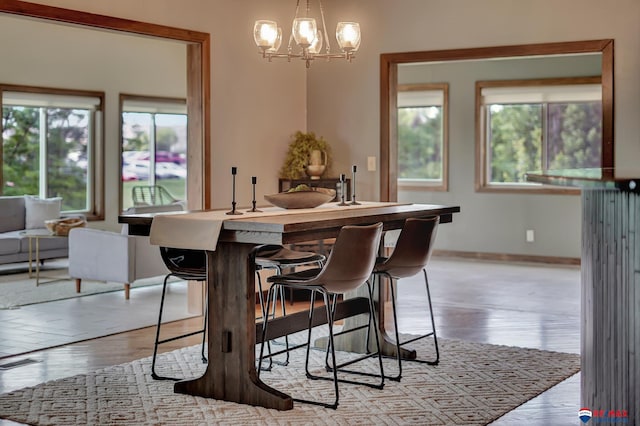 dining room featuring a chandelier and light wood-type flooring